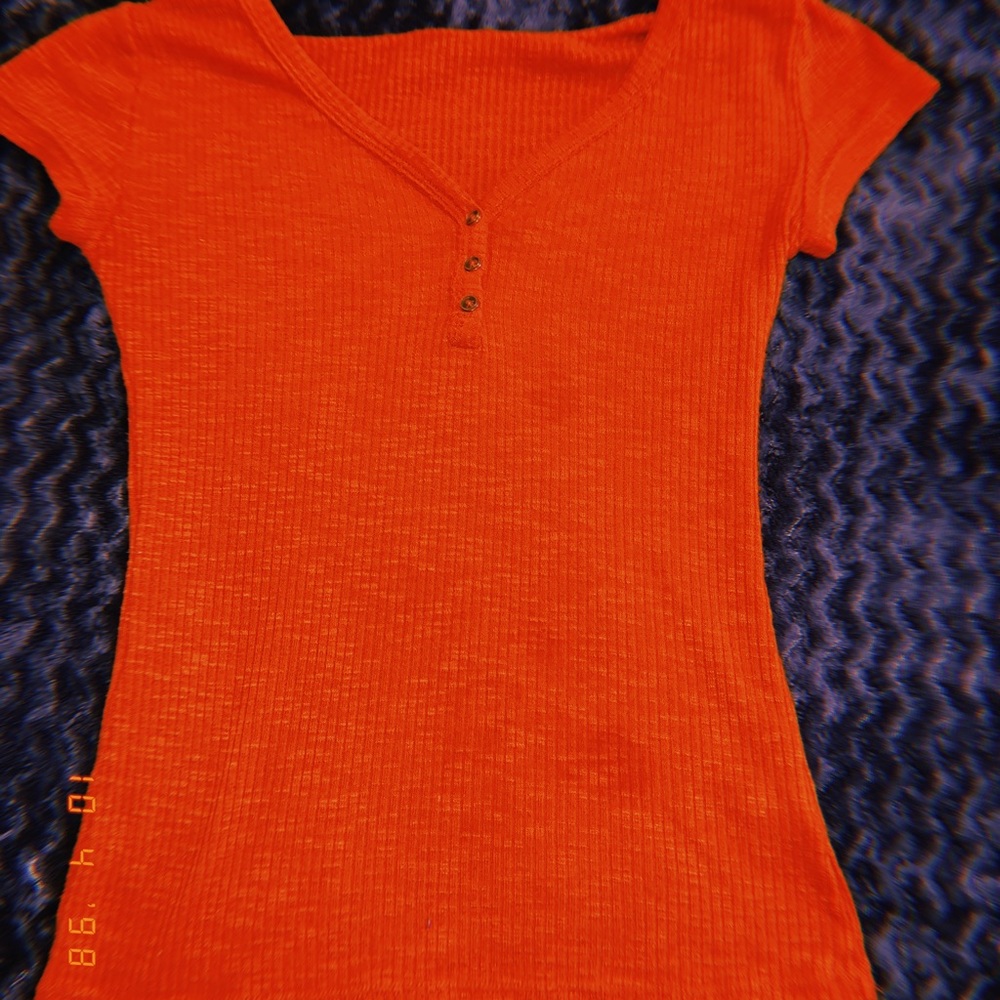Orange fitted button v neck top.